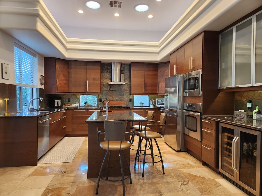 Large custom kitchen with air fryer, drip coffee maker as well as Nespresso machine, juicer, blender and more