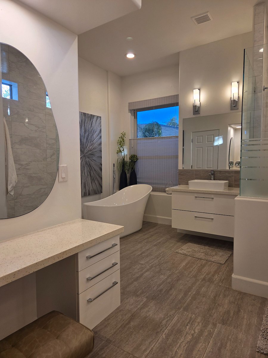 En-suite bath with 2 vanities, make up desk, free standing tub and large shower