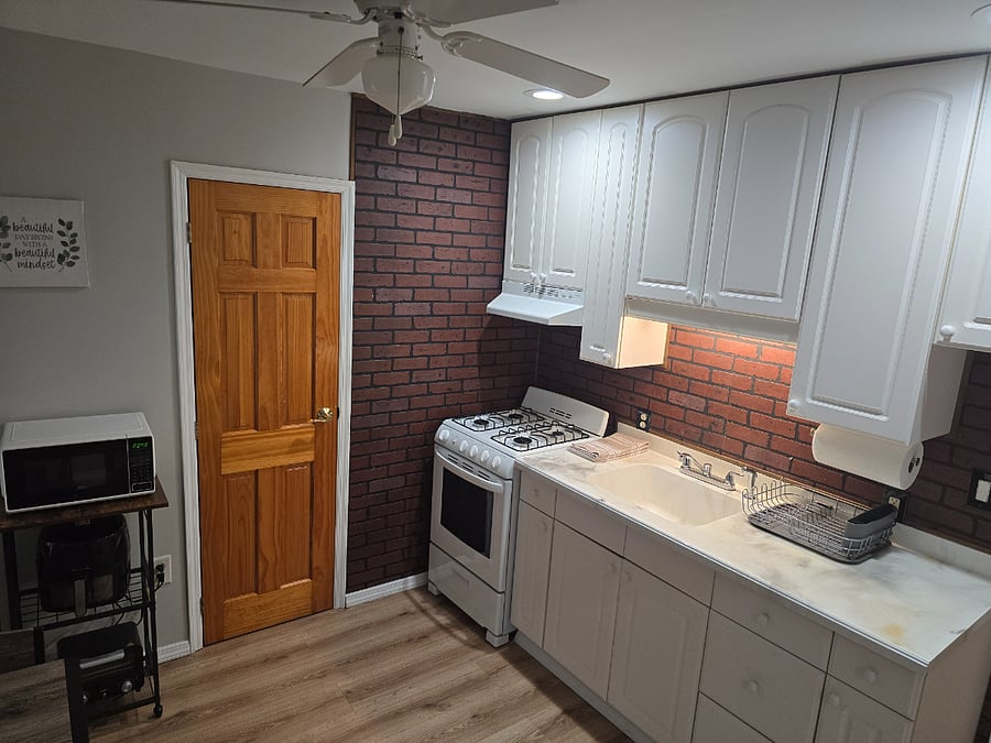 Kitchen area and entrance to bathroom