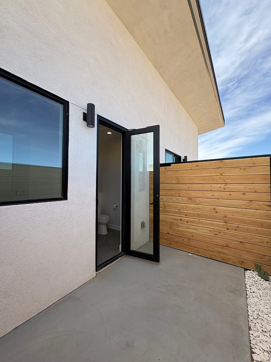 View from bedroom 2 patio to interior restroom.