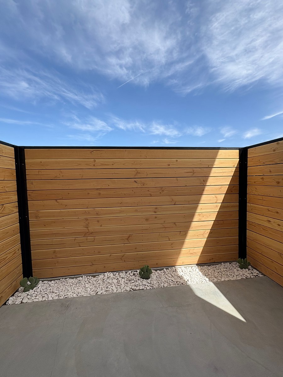 Enclosed private patio exterior bedroom 2. Seating in progress.
