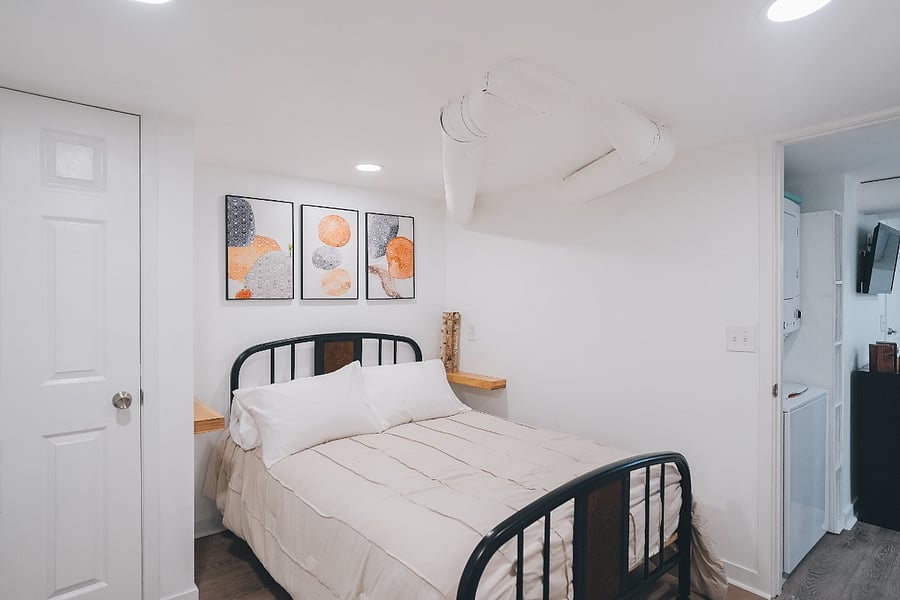 Power outlets and shelves on each side of the bed