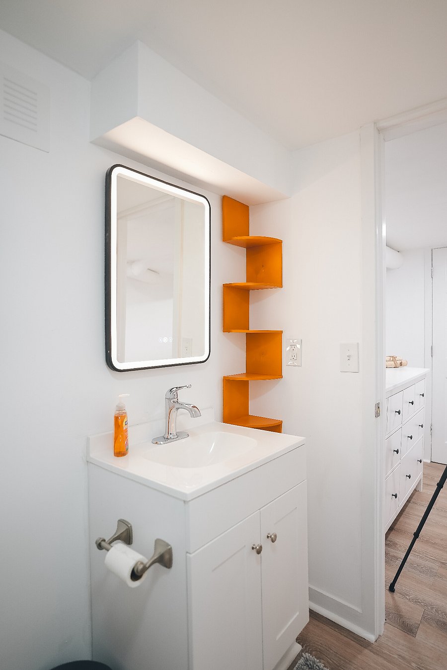 Lighted vanity and with internal storage in the mirror