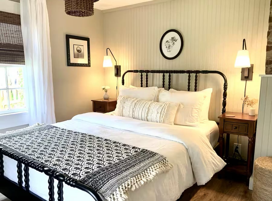 Bedroom has a queen bed with white cotton sheets and linen duvet cover.