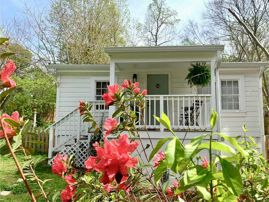 Covered front porch with bistro table and chairs