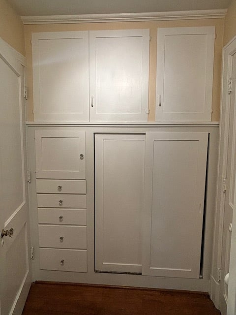Storage in area between bedroom and bathroom