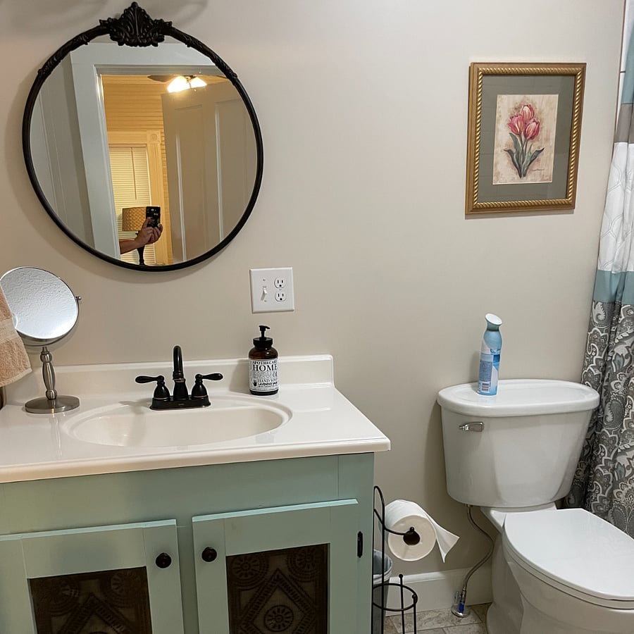 The bathroom off the main bedroom is well lit and comes complete with a magnifying make-up mirror.