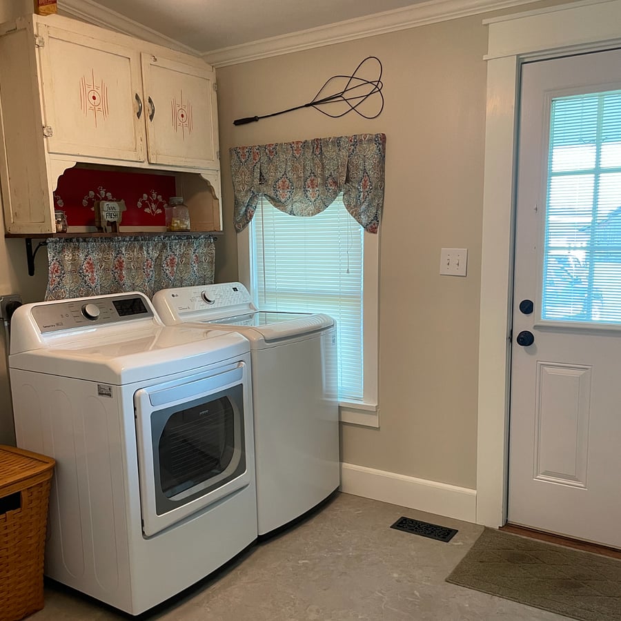 The washer and dryer is located off the kitchen.