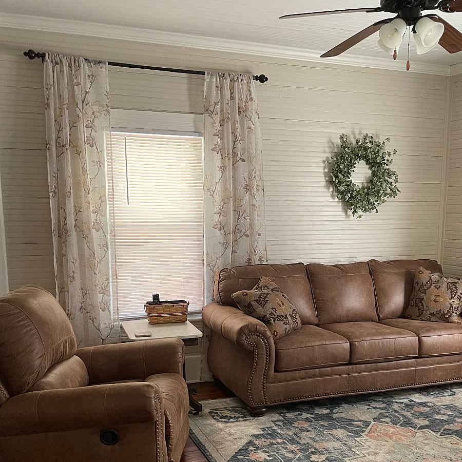The living room has a ceiling fan to ensure year-round comfort.