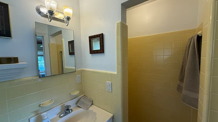 Step into your own personal oasis with this luxurious walk-in shower bathroom, designed for both comfort and style. The spacious layout creates a serene and inviting atmosphere, offering a perfect retreat after a long day.