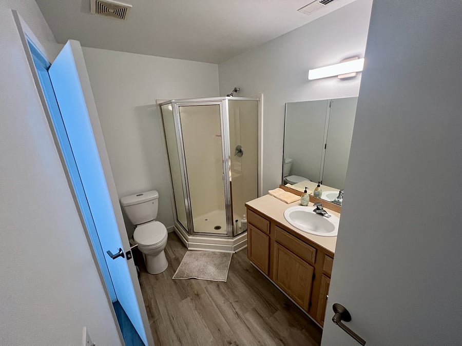 Bathroom 1. Attached to Bedroom 1 and Hallway.