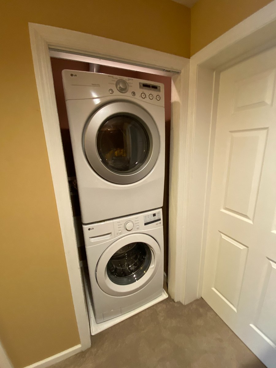 Laundry just got a whole lot easier! This convenient laundry area is located right outside the primary bedroom, featuring a modern stacked washer and dryer. No lugging laundry up and down the stairs!