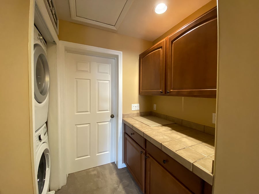 Laundry just got a whole lot easier! This convenient laundry area is located right outside the primary bedroom, featuring a modern stacked washer and dryer. No lugging laundry up and down the stairs!