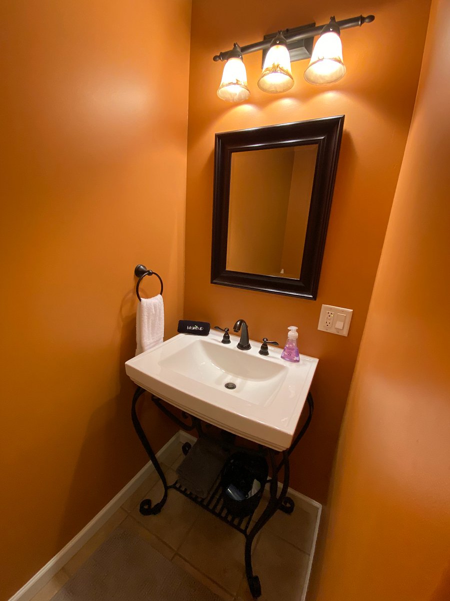 Located just down the hall from the secondary bedroom, this dedicated bathroom offers convenience and privacy. It's a full bathroom, complete with a sink, toilet, and a tub/shower combination for your guest's comfort and ease.