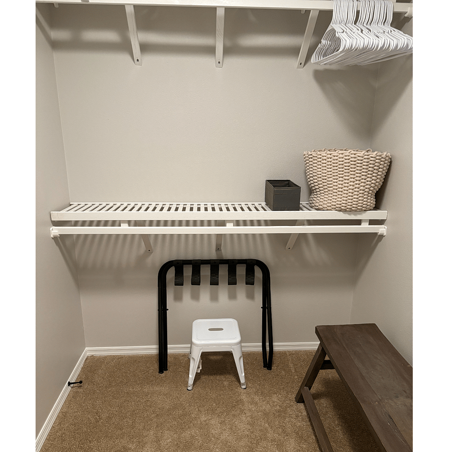 MASTER CLOSET: Ample storage on solid wood shelves. Luggage rack.