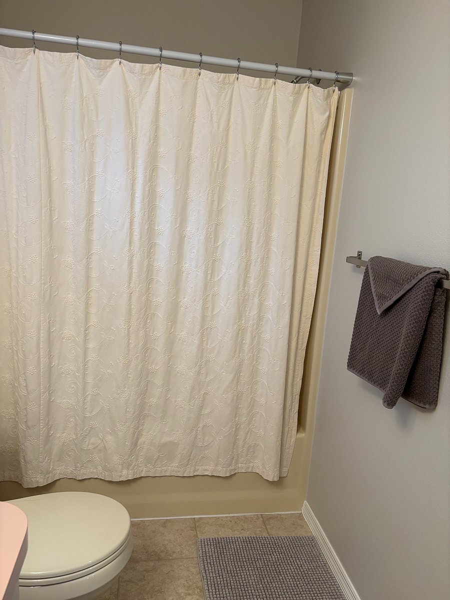 GUEST BATH: Full tub and shower with detachable magnetic Kohler shower head with variable settings.