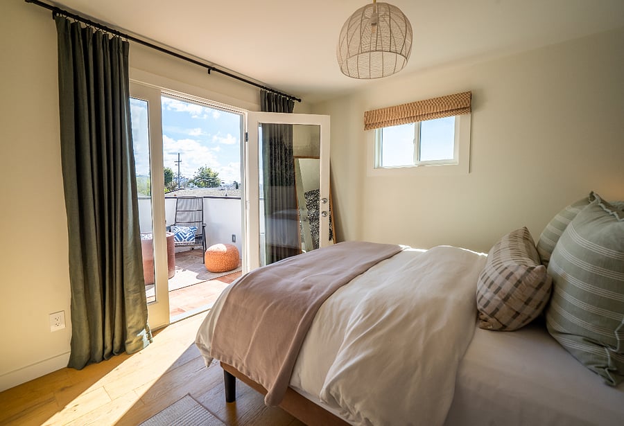Room leads towards private terrace space.