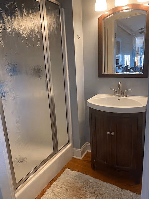 Tenant bathroom with shower, vanity and toilet.