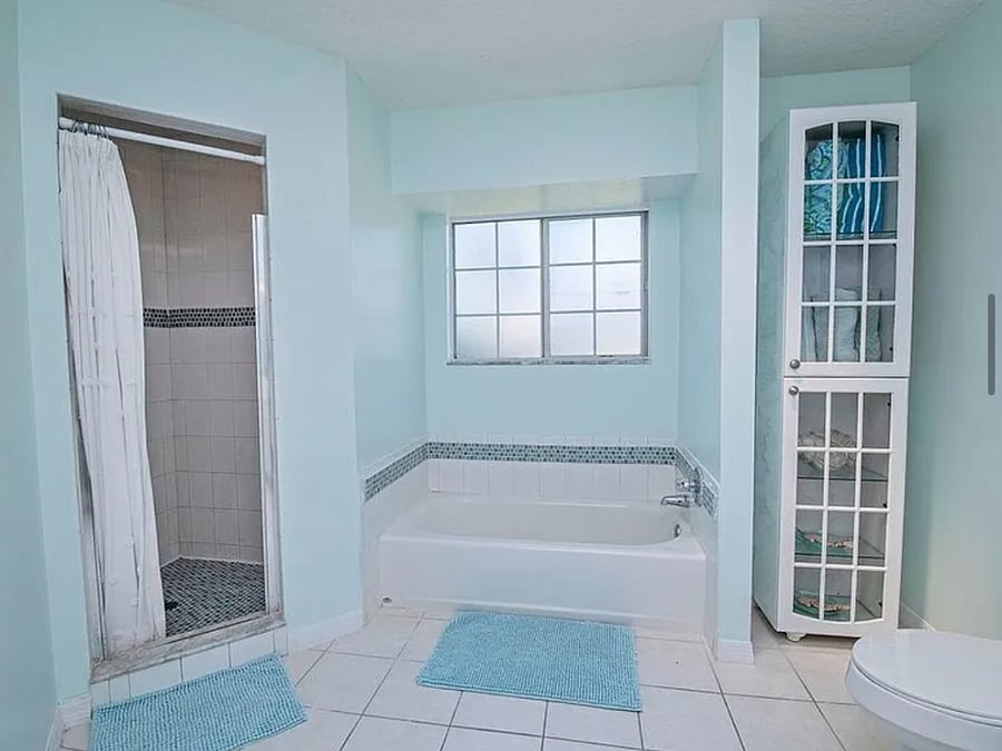 En-suite bathroom with tub and shower