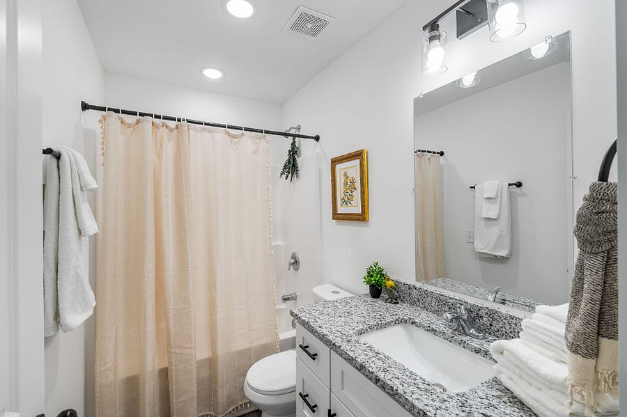 Upstairs full bathroom with tub and good storage.