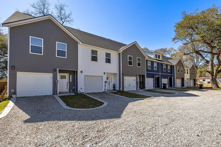 Our community of 8 consecutive townhomes with lovely gravel drive and parking.