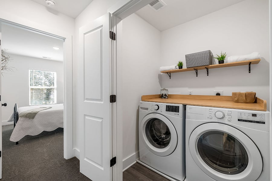 Brand new washer and dryer with folding table located right outside of all bedrooms for easy access.