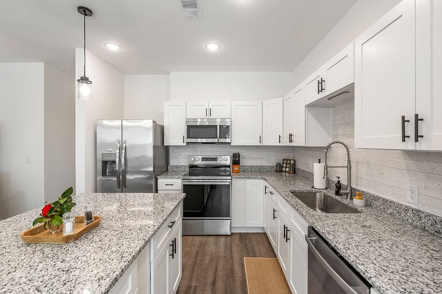 Fully stocked kitchen with small appliances, cookware, dishware, utensils, silverware, etc.