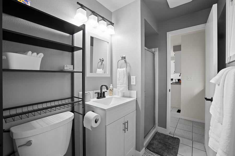 Shower only, no bathtub in this ensuite. Bathroom also has a door to the kitchen, with a lock on both doors.