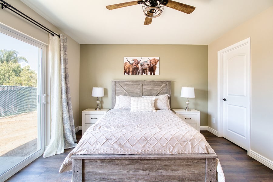 Master Bedroom with Walk In Closet and Sliding Glass door to Back Patio. Queen Bed with Plush Premium Mattress, 50 Inch Smart TV, Blackout window treatment & Work Desk