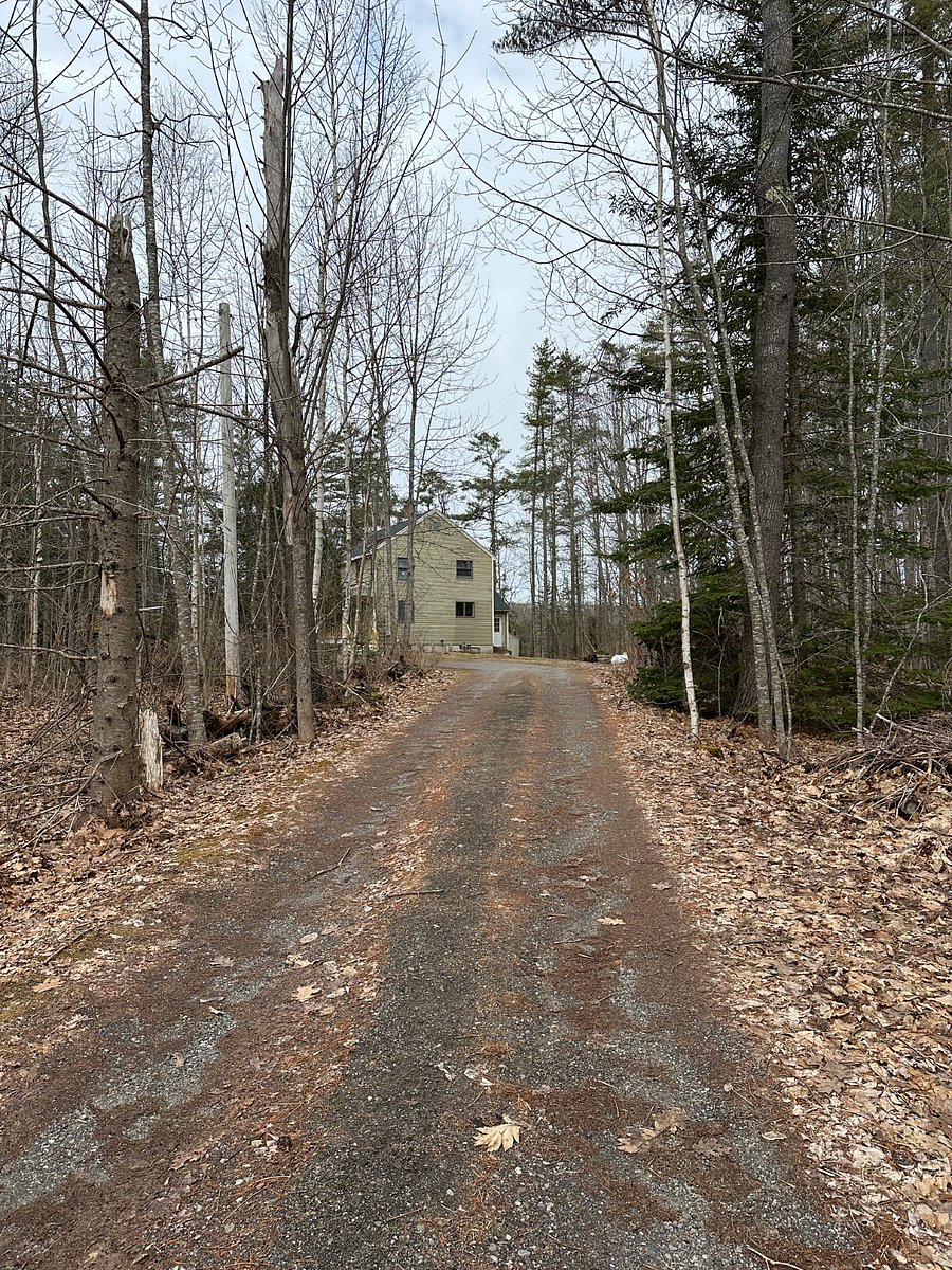 Plenty of room for parking in the gravel driveway.