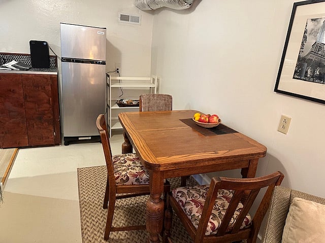 dining room table and partial view of kitchen