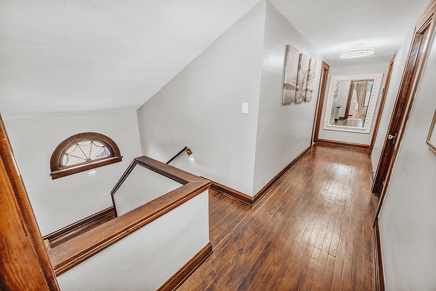 A Quiet Step Away. The hallway leads to your comfortable third-floor space, tucked away from the everyday activity of the home.