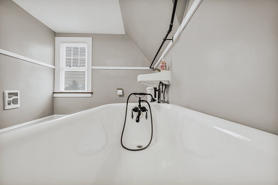A Touch of Vintage Charm The beautiful clawfoot tub is one of the home's standout architectural details, adding character and boutique-style charm to the bathroom.