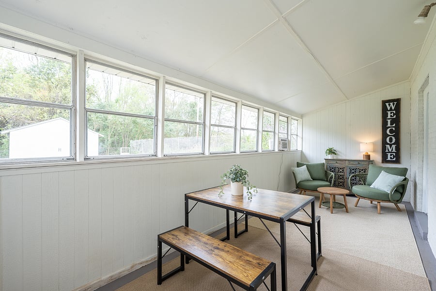 Sunroom has a window AC unit
