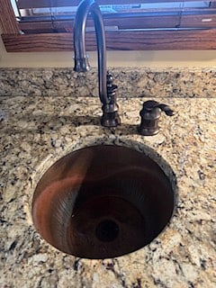 beautiful copper hammered sink in kitchenette and bathroom