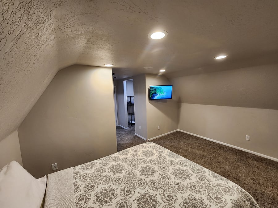 Loft style room with TV and open space.