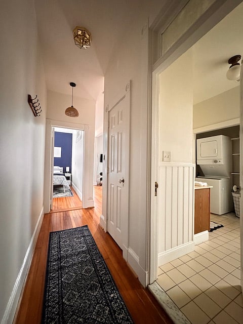 Hallway leading to bedroom and bathroom has large linen closet