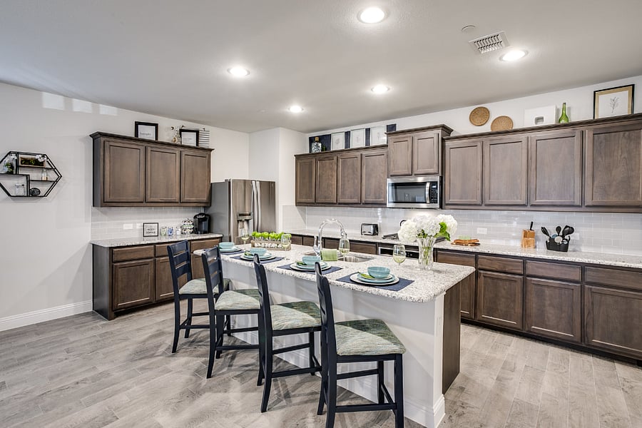 Open space kitchen with stainless steel appliances, granite counters, and gas range.