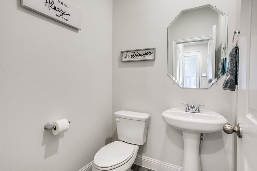 1/2 bathroom located on first floor by livingroom.
