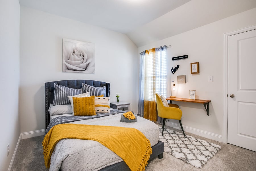 2nd Bedroom with queen bed, work desk and chair, smart tv, and walk-in closet.