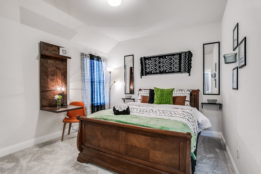 3rd bedroom with queen bed, work desk, smart TV, and walk-in closet.