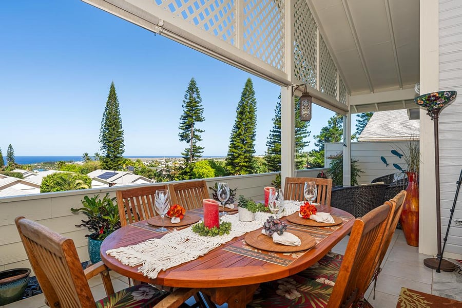 Lanai teak table with seating for six and ocean views.