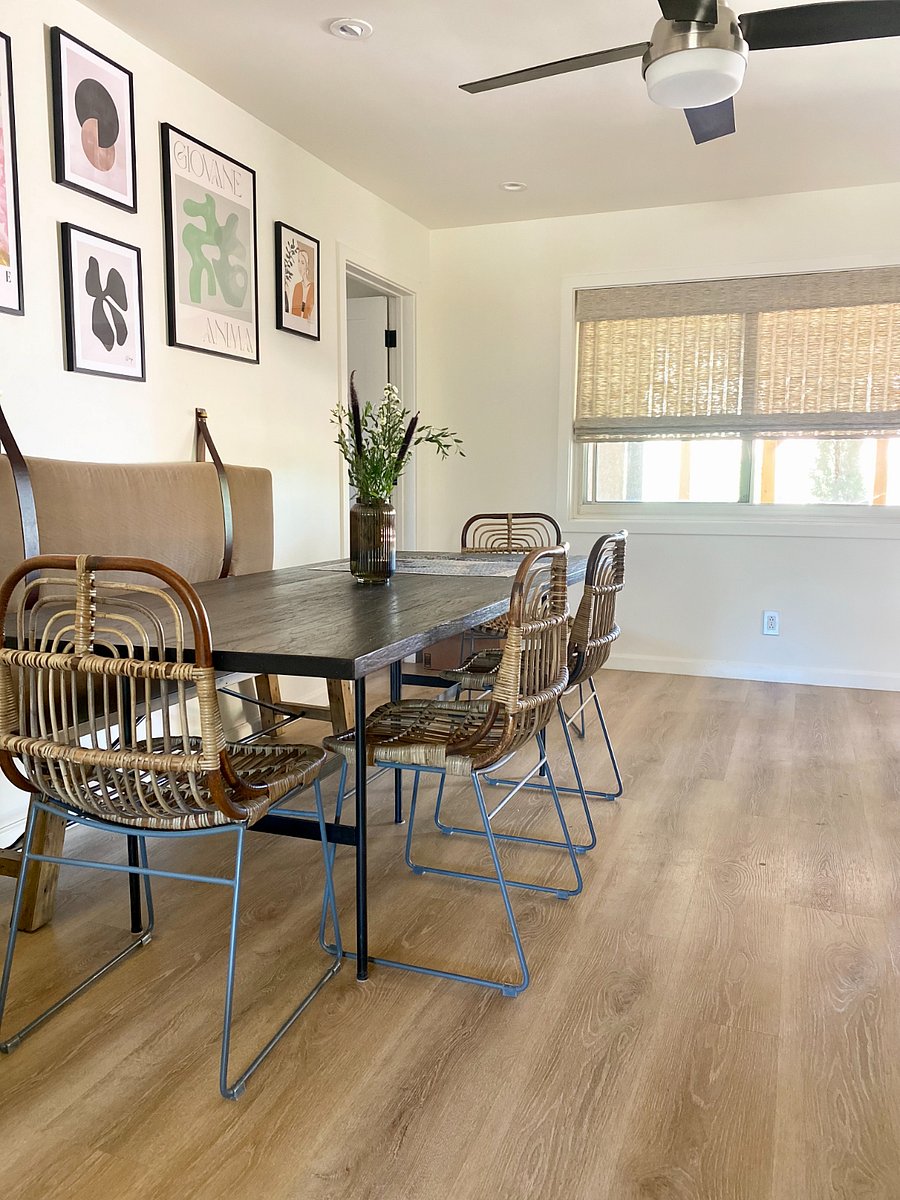 Dining room with primary bedroom door beyond