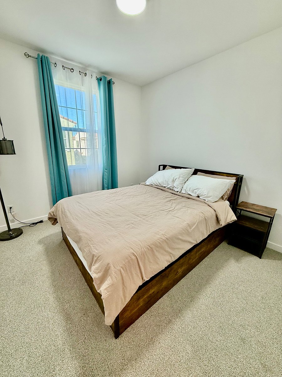 2nd bedroom with a queen size bed and a closet