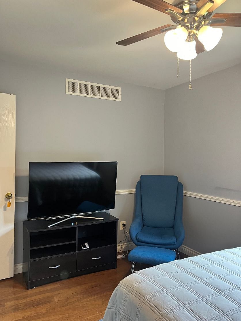 flat screen tv and sitting chair. Chair can be swapped out for a desk, if desired