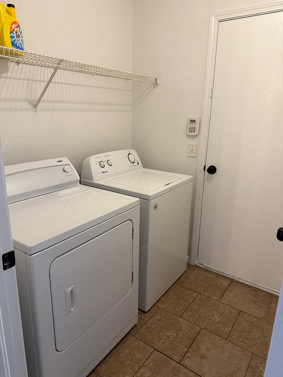 Washer and dryer accessible from hallway and garage 