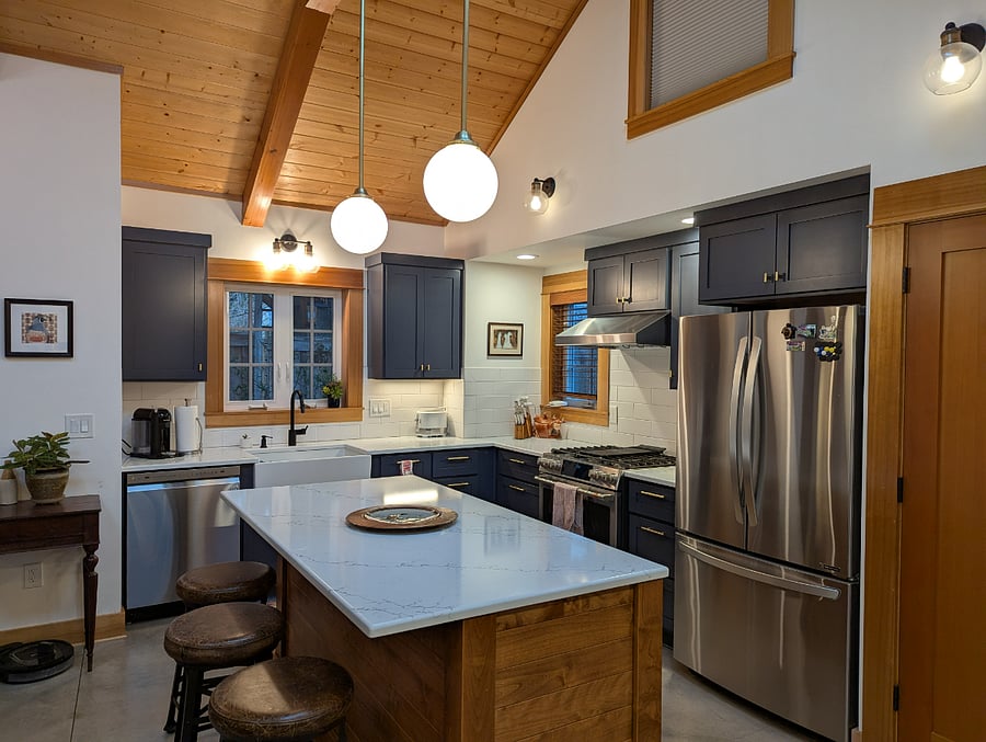 Chef's kitchen with quartz counters, dual fuel range, farm house sink.