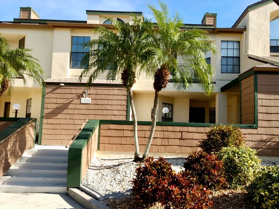 Enjoy the beautiful palm trees and greenery located outside the complex.