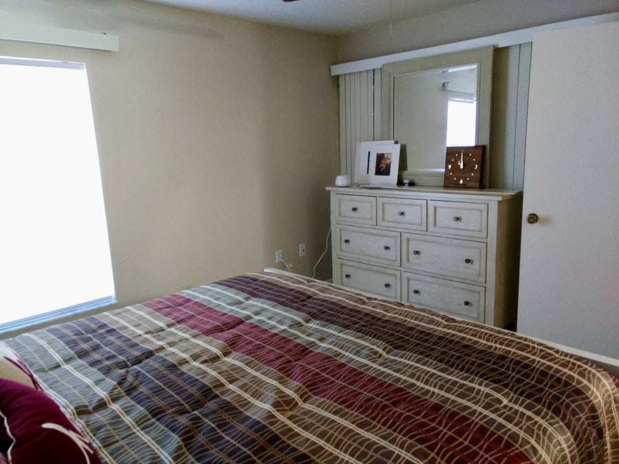 Each bedroom features a dresser and closet providing guests with plenty of clothing storage.