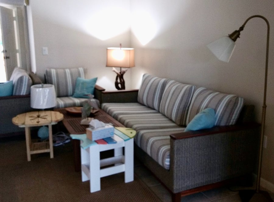 The lamps in the living room provide additional lighting, which is perfect for reading!